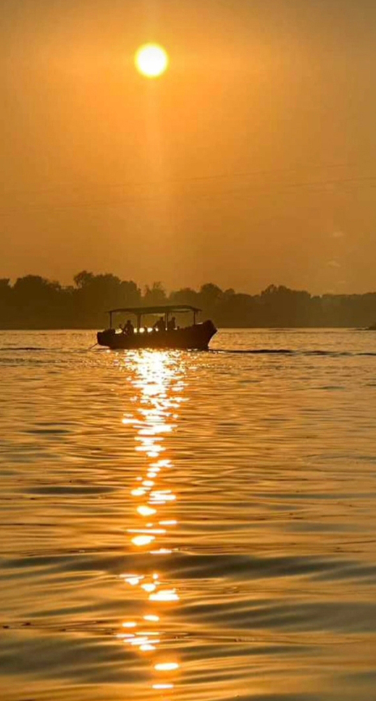 Sunset Boat on River